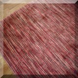 DR01. Multi-colored red rug. Measures approx. 13'5” x 12' 
